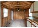 Shed interior with wood paneling, offering potential for storage or conversion to a unique living space at 3345 Long Ferry Rd, Salisbury, NC 28146