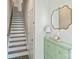Inviting entryway featuring stairs to the upper level and a decorative storage console with a stylish mirror at 3722 Ellington St, Charlotte, NC 28211