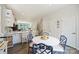 Open concept kitchen and dining area featuring white cabinets and seating at the island at 3722 Ellington St, Charlotte, NC 28211
