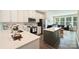 Well-lit kitchen with stainless steel appliances, white cabinets, and a convenient center island at 3722 Ellington St, Charlotte, NC 28211