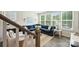 Bright living room boasts large windows, a blue sectional, and stylish decor for a cozy atmosphere at 3722 Ellington St, Charlotte, NC 28211