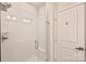 Modern walk-in shower with white tiled walls and a clear glass door in a bright bathroom at 3722 Ellington St, Charlotte, NC 28211