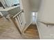 View of wooden stairs descending to the lower level next to the kitchen at 3722 Ellington St, Charlotte, NC 28211