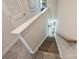 Carpeted staircase with wood and painted trim, leading to a naturally lit living space at 3722 Ellington St, Charlotte, NC 28211