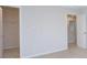 A bedroom with neutral paint and carpet leads to a closet and another room at 427 Carolina Hemlock Dr, Locust, NC 28097