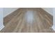 Close-up of the wood-look flooring, showing its natural wood grain and light color at 427 Carolina Hemlock Dr, Locust, NC 28097