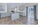 New kitchen with granite countertops, light gray cabinets, stainless steel appliances, and a central island at 427 Carolina Hemlock Dr, Locust, NC 28097