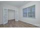 Bright office space with French doors, a large window, and wood-look flooring at 427 Carolina Hemlock Dr, Locust, NC 28097