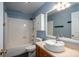 This cozy bathroom features blue walls, a toilet, sink, vanity and shower/tub combo at 5129 Whitetail Ct, Crouse, NC 28033
