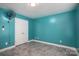 This colorful bedroom features blue walls, tile flooring, a window with blinds, and a ceiling fan at 5129 Whitetail Ct, Crouse, NC 28033
