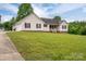 Charming home with an attached two-car garage and a well-manicured lawn at 5129 Whitetail Ct, Crouse, NC 28033