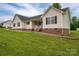 Charming home with brick-lined foundation and a well-manicured lawn at 5129 Whitetail Ct, Crouse, NC 28033