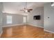 Spacious living room features vaulted ceiling, hardwood floors, and modern ceiling fan at 5129 Whitetail Ct, Crouse, NC 28033