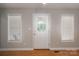 Bright living room features wood floors, neutral walls, and a glass-paneled door at 5129 Whitetail Ct, Crouse, NC 28033