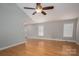 Bright living room features wood floors, neutral walls, and a ceiling fan at 5129 Whitetail Ct, Crouse, NC 28033