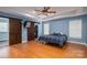 The main bedroom has a tray ceiling, wood floors, and a barn door leading to the walk-in closet at 5129 Whitetail Ct, Crouse, NC 28033