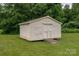 An outbuilding on skids with a ramp to the door is the backyard of a home for sale at 5129 Whitetail Ct, Crouse, NC 28033