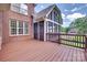 Spacious wooden deck connecting to a screened porch, perfect for outdoor living and entertaining at 5164 Mill Race Ln, Lancaster, SC 29720