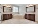 Luxurious bathroom with a large soaking tub, double vanity sinks, and beautiful mirrors at 5164 Mill Race Ln, Lancaster, SC 29720