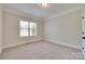 Bright bedroom with neutral carpet and large window at 5164 Mill Race Ln, Lancaster, SC 29720