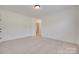 Neutral carpeted bedroom featuring white walls, trim, and open doorway at 5164 Mill Race Ln, Lancaster, SC 29720
