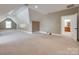 Spacious carpeted bonus room with sloped ceilings, white trim, and a view of the bathroom at 5164 Mill Race Ln, Lancaster, SC 29720