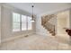 Bright dining area with tile flooring, a view of the staircase and a hanging light fixture at 5164 Mill Race Ln, Lancaster, SC 29720