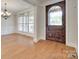 Elegant foyer featuring a decorative front door, hardwood floors, and natural light at 5164 Mill Race Ln, Lancaster, SC 29720