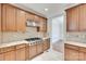Kitchen with stainless steel gas cooktop and matching vent hood at 5164 Mill Race Ln, Lancaster, SC 29720
