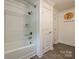 Well-lit bathroom featuring a tub and shower at 5222 Sikes Mill Rd, Monroe, NC 28110