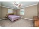 Neutral bedroom with carpet, fan, and natural light at 5222 Sikes Mill Rd, Monroe, NC 28110