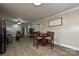 Open living area combining the kitchen, dining, and living spaces for flexible use at 5222 Sikes Mill Rd, Monroe, NC 28110