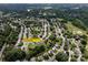 Aerial view of a neighborhood featuring houses and lush green trees at 5741 Bentgrass Run Dr, Charlotte, NC 28269