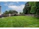 Spacious backyard featuring a well-maintained lawn and a wood surrounding fence at 5741 Bentgrass Run Dr, Charlotte, NC 28269