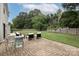 Backyard with patio area, well-maintained lawn and a surrounding fence at 5741 Bentgrass Run Dr, Charlotte, NC 28269