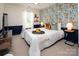 Charming bedroom with citrus-themed wallpaper, creating a refreshing and inviting space for relaxation at 5741 Bentgrass Run Dr, Charlotte, NC 28269