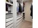 Organized walk-in closet featuring built in shelving and drawers for optimal storage at 5741 Bentgrass Run Dr, Charlotte, NC 28269