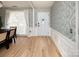 Welcoming entryway with wood floors, decorative wallpaper, and front door at 5741 Bentgrass Run Dr, Charlotte, NC 28269
