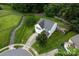 Aerial front exterior view of a two-story home with a well manicured lawn at 5741 Bentgrass Run Dr, Charlotte, NC 28269