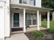 Inviting front porch with decorative plants and charming details at 5741 Bentgrass Run Dr, Charlotte, NC 28269