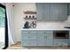 This spacious kitchen features shaker cabinets, white countertops and floating shelves at 5741 Bentgrass Run Dr, Charlotte, NC 28269