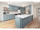 Charming kitchen featuring shaker cabinets, white countertops, stainless appliances, and center island at 5741 Bentgrass Run Dr, Charlotte, NC 28269