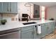 Bright eat-in kitchen showcases a large center island, black faucet and open sightlines to the Gathering room at 5741 Bentgrass Run Dr, Charlotte, NC 28269