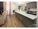 Charming eat-in kitchen featuring white countertops, stainless appliances and access to the living room at 5741 Bentgrass Run Dr, Charlotte, NC 28269