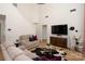 Large living area with high ceilings, ample seating, and a statement fireplace at 5741 Bentgrass Run Dr, Charlotte, NC 28269