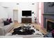 Bright living room features hardwood floors, a decorative fireplace, and ample seating space at 5741 Bentgrass Run Dr, Charlotte, NC 28269