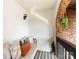 Inviting balcony with comfortable seating, brick accents, and stylish decor at 5809 Sharon Rd # G, Charlotte, NC 28210