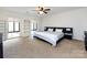 Spacious bedroom with large windows, built-in shelving and neutral carpet at 5809 Sharon Rd # G, Charlotte, NC 28210