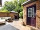 Inviting outdoor patio with comfortable seating, brick accents, and string lights at 5809 Sharon Rd # G, Charlotte, NC 28210