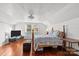 Finished attic bedroom with hardwood floors, white walls, a window and standard-sized bed at 606 1St W St, Conover, NC 28613